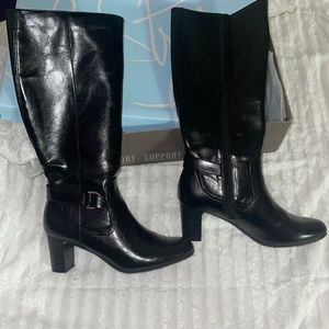 Black heeled boots with silver buckle